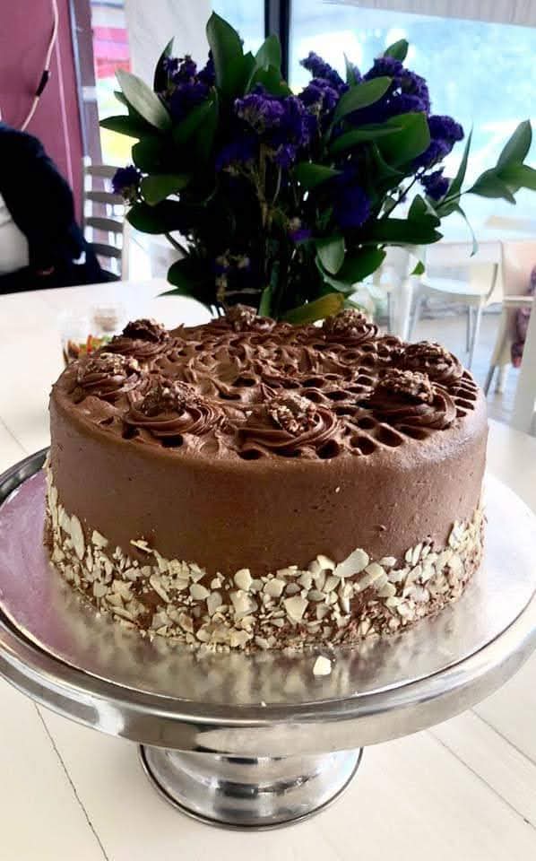 Chocolate cake finished with hazelnut truffles and almond flakes