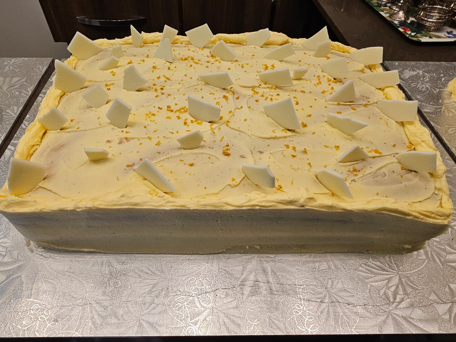 Lemon slab cake topped with white chocolate shards